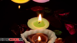 دانلود استوک فوتیج : شمع های شناور میان برگ گل Candles , Dry Leaves On Water