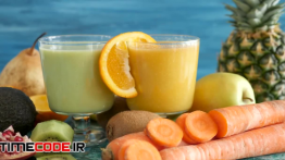 دانلود استوک فوتیج : آب پرتغال و میوه جات Juice And Fruits On Display