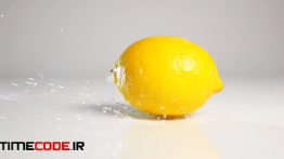 دانلود استوک فوتیج : افتادن لیمو روی زمین خیس Lemon Falling On Wet Surface