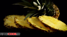 دانلود استوک فوتیج : برش های آناناس Slices Of Pineapple Rotating Slowly