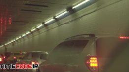 دانلود استوک فوتیج : ترافیک ماشین ها در تونل Slow Car Taillights Stuck In Traffic In Busy Tunnel