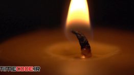 دانلود استوک فوتیج : شعله شمع در تاریکی Candle Light Close Up Burning In The Dark