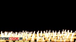 دانلود فوتیج موشن گرافیک : شمع ها در پس زمینه مشکی Candles In The Night