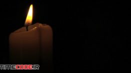 دانلود استوک فوتیج : نما بسته شمع در تاریکی Close Up On Antique Candle Burning
