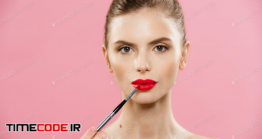 دانلود عکس آرایش صورت Beauty Concept – Woman Applying Red Lipstick