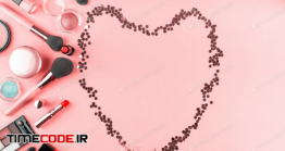 دانلود عکس استوک : لوازم آرایشی با فریم قلب Make Up Products On Pink With Confetti Heart Frame
