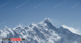 دانلود عکس استوک : کوه برفی Mountain Peak Against A Blue Sky