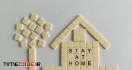 دانلود عکس مفهومی در خانه بمانیم A Home Made With Tiles And The Phrase “Stay At Home”