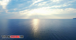 دانلود فوتیج حرکت روی دریا Drone View Golden Sunshine Over Sea Water