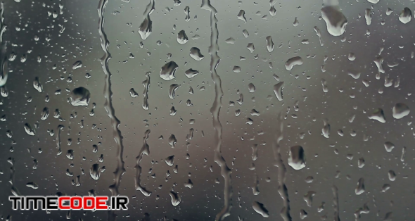 دانلود فوتیج بارش باران روی شیشه Rain Drops On Window – تایم کد