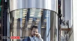 دانلود عکس مرد در آسانسور شیشه ای Businessman In Modern Glass Elevator