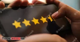 دانلود عکس ستاره دادن در صفحه موبایل Attractive Hands Giving Four Point Five Star Rating On A Smart Phone