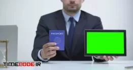 دانلود فوتیج پرده سبز پاسپورت در دست مرد Migration Agent Holding Passport And Tablet