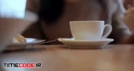 دانلود فوتیج نوشیدن چای داغ Woman Pours Hot Water From The Kettle Into The Cup