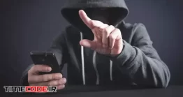 دانلود عکس هکر در حال استفاده از موبایل Hacker Using Smartphone And Touching In Empty Screen