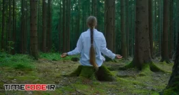 دانلود فوتیج مدیتیشن در جنگل Dark Blonde Woman Meditating In Forest