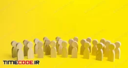 دانلود عکس گروه از مردم به شکل مجسمه چوبی در زمینه زرد  A Large Group Of Figurines Of People