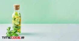 دانلود عکس لیمو تازه در بطری Fresh Cool Lemon-mint Water