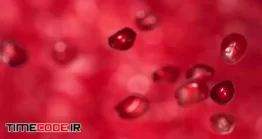 فوتیج حرکت آهسته پرتاب دانه های انار در آب Pomegranate Seeds Falling On Water Surface