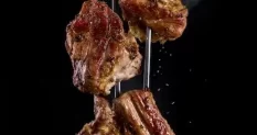 fork with pieces delicious barbecued meat black 5325804 cover 1