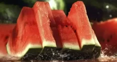 pieces of watermelon fall on a wet board filmed 32967974 cover 1