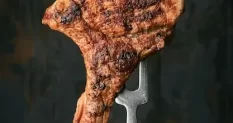 pork steak fork wooden background rosemary 22796498 cover 1