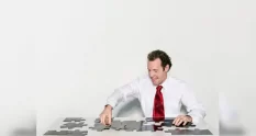 a business man doing a jigsaw 36488 cover 1