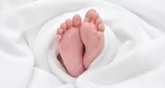 low section baby wrapped white blanket 109711804 cover 1